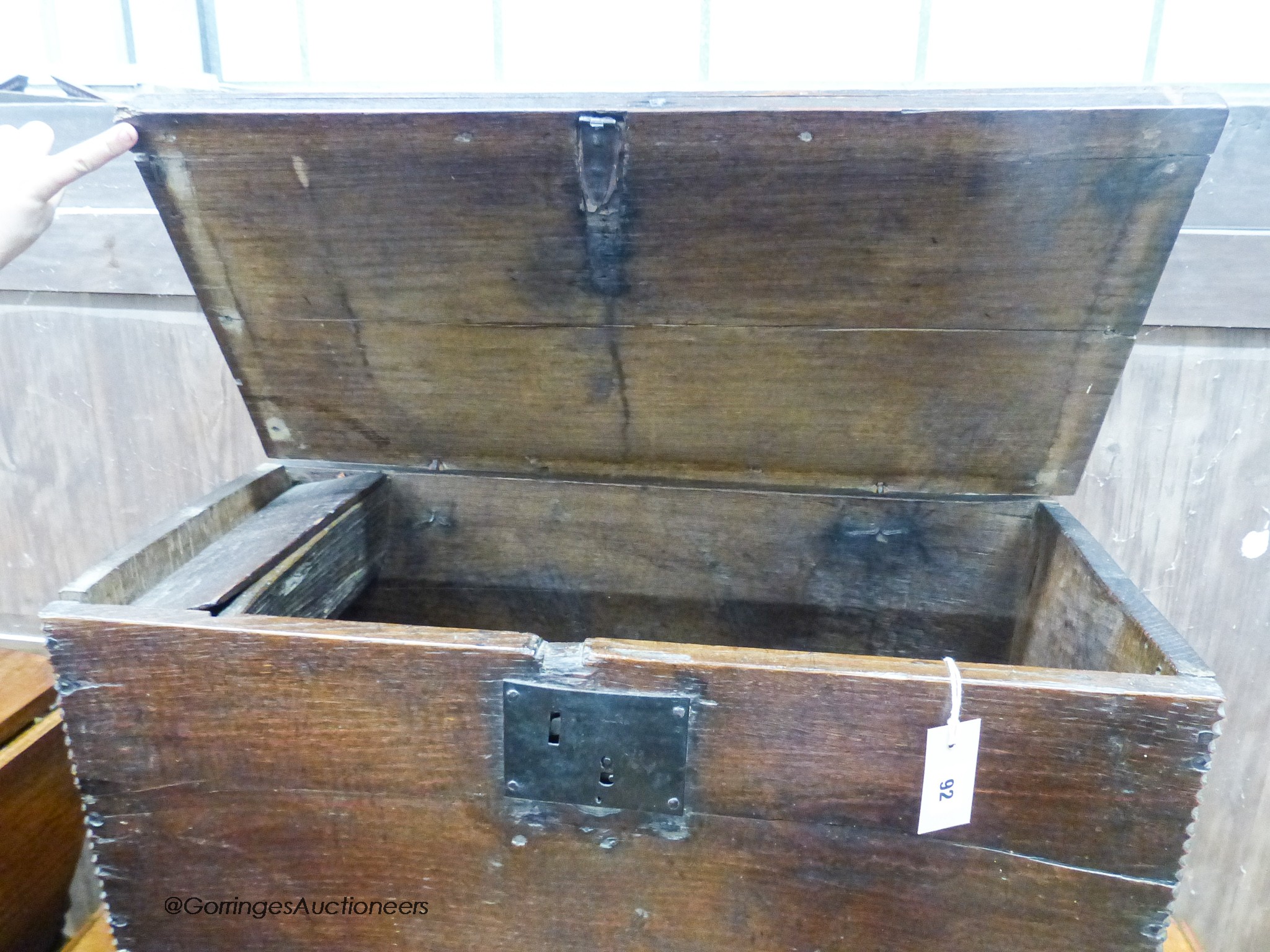 A 17th century oak six-plank coffer of small proportions